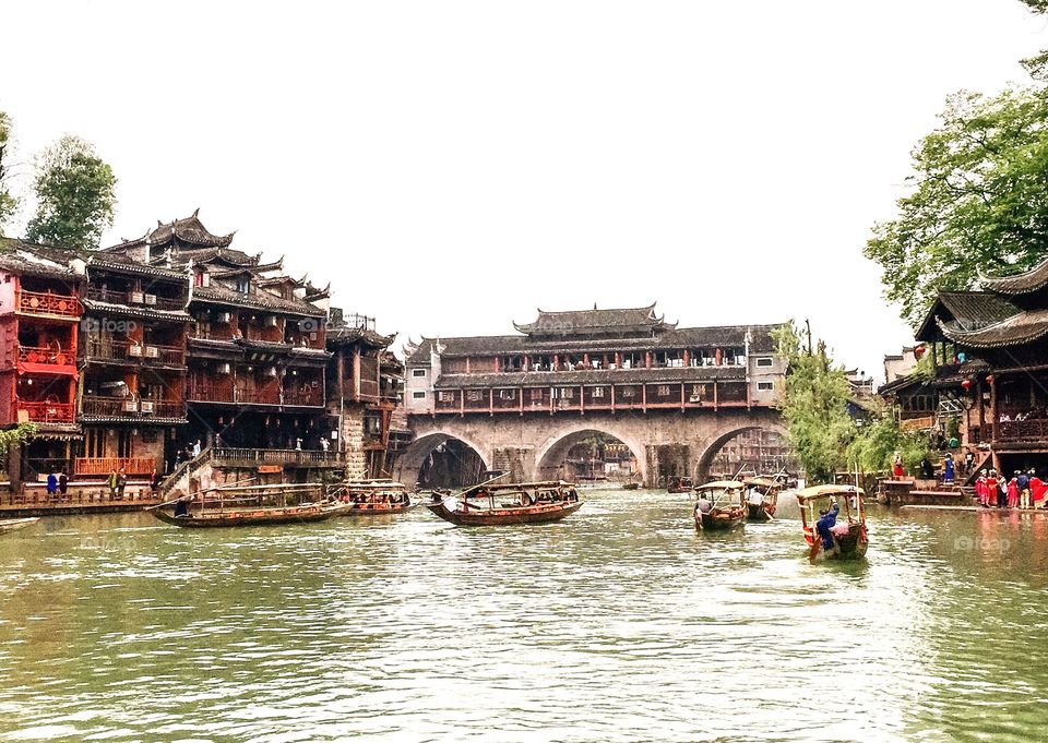 River, boats, pile dwellings, Chinese traditional buildings, bridge, Phoenix City, Hunan, China