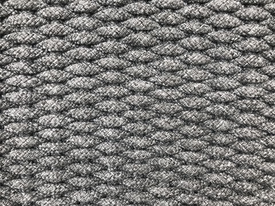 weaving grey small tight cotton rolls as a pattern of wicker, using for background