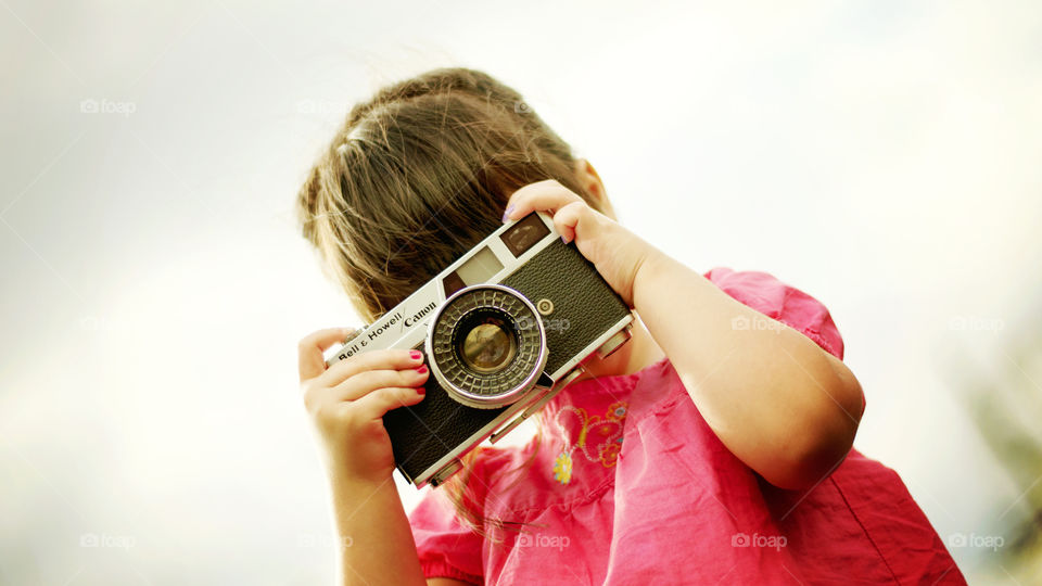 Cute little girl photographer vintage Canon 