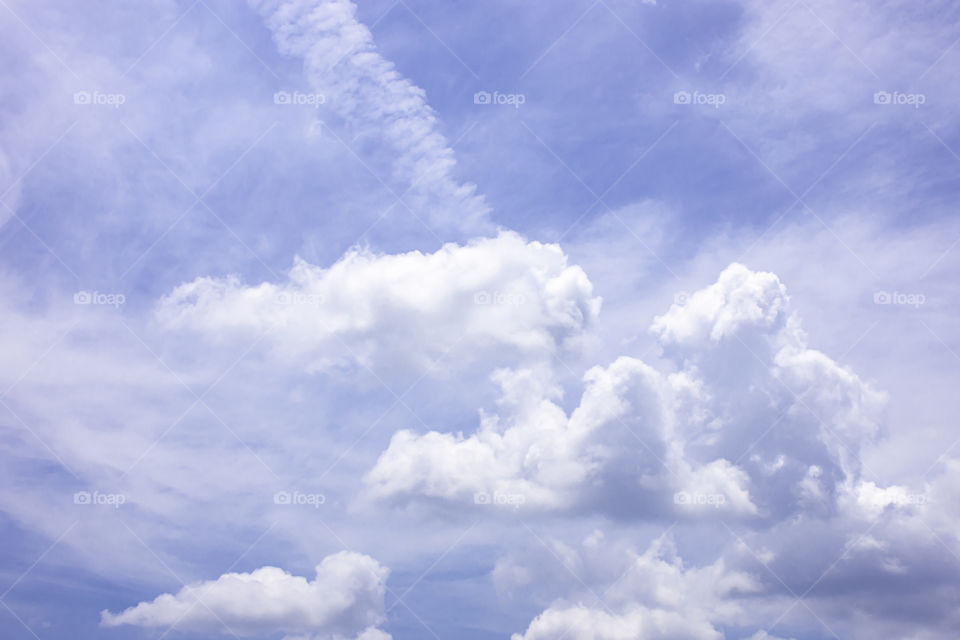 The beauty of the sky with clouds and the sun.