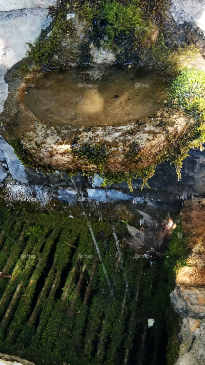 A spring pooring fresh water from the mountain in St Vlasios Monastery,Greece