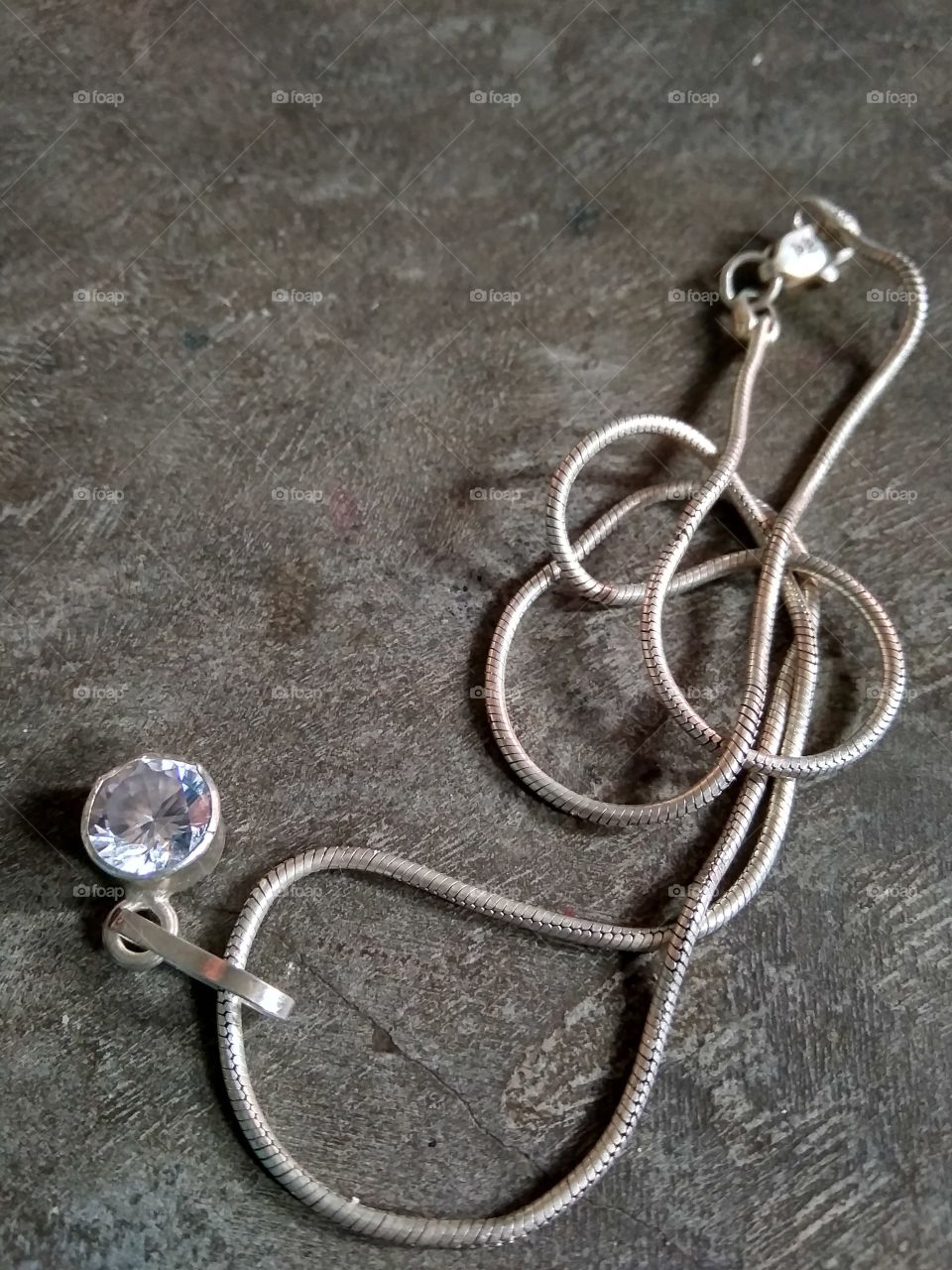 a silver chian on the surface