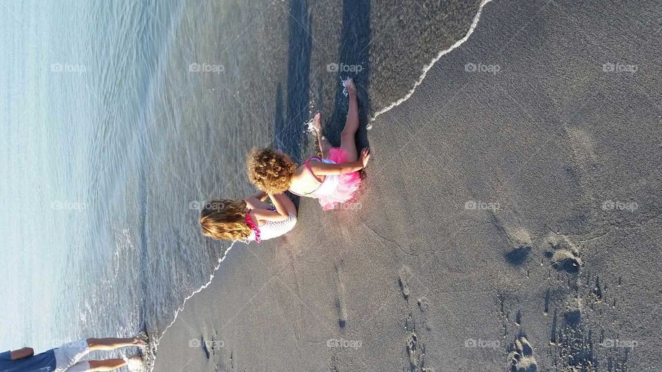 beachkids. sitting on the beach