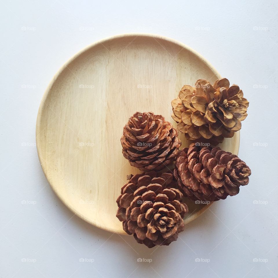 Pine seeds in dish.