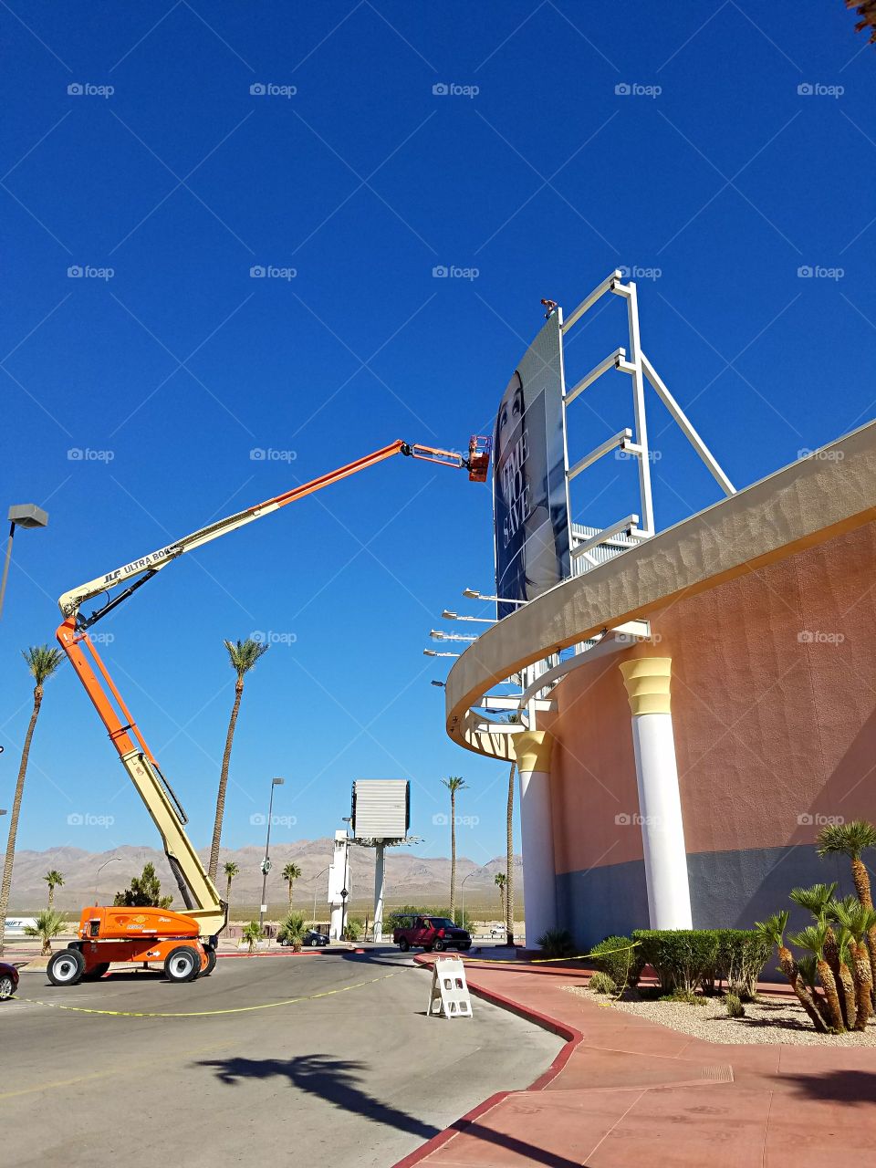 Orange Crane working in the hot desert sun!