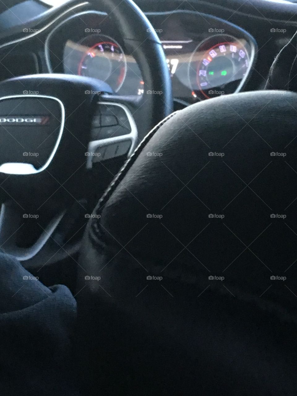 Sitting in the back seat of this challenger checking out the dashboard. I’m in love!