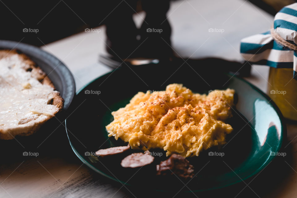 simple, traditional Polish breakfast. fresh eggs with butter, fresh bread, sausage