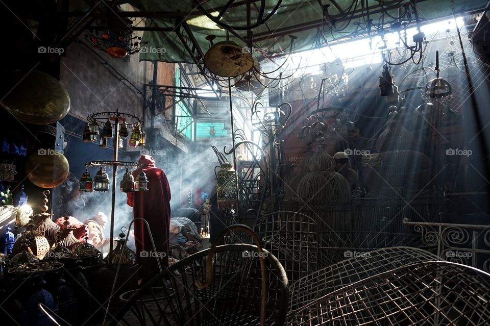 Red Djellaba into the iron souk of the Medina of Marrakech