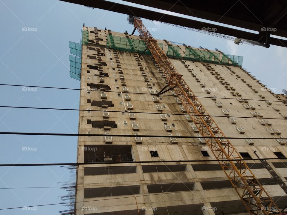 unfinished building beside to the train station