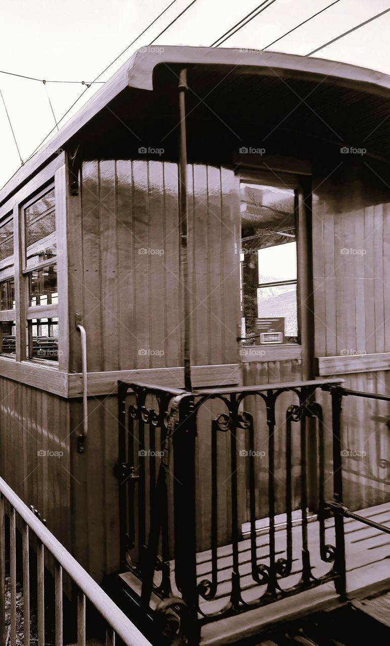 Vintage sepia shot of the rear of a carriage of an 1930 train in Porto-Cristo