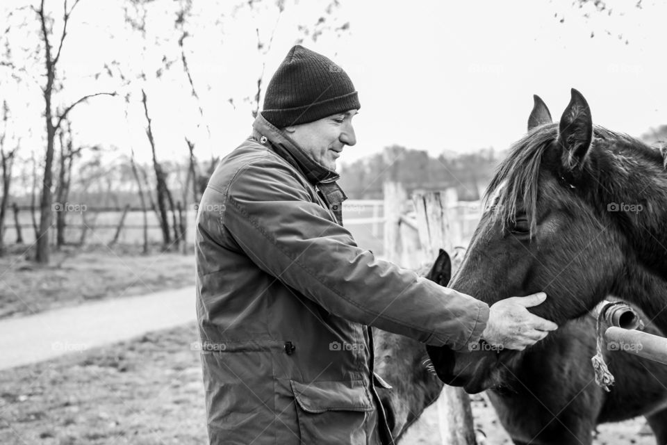 A mature man with his horse