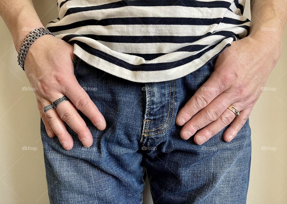 Man’s hands with rings and silver bracelets 