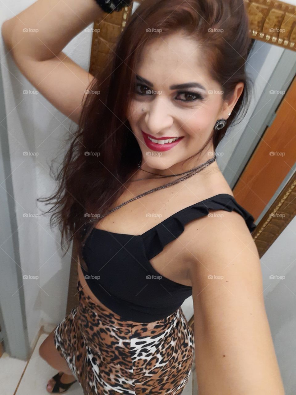 smiling and happy woman in animal print clothes