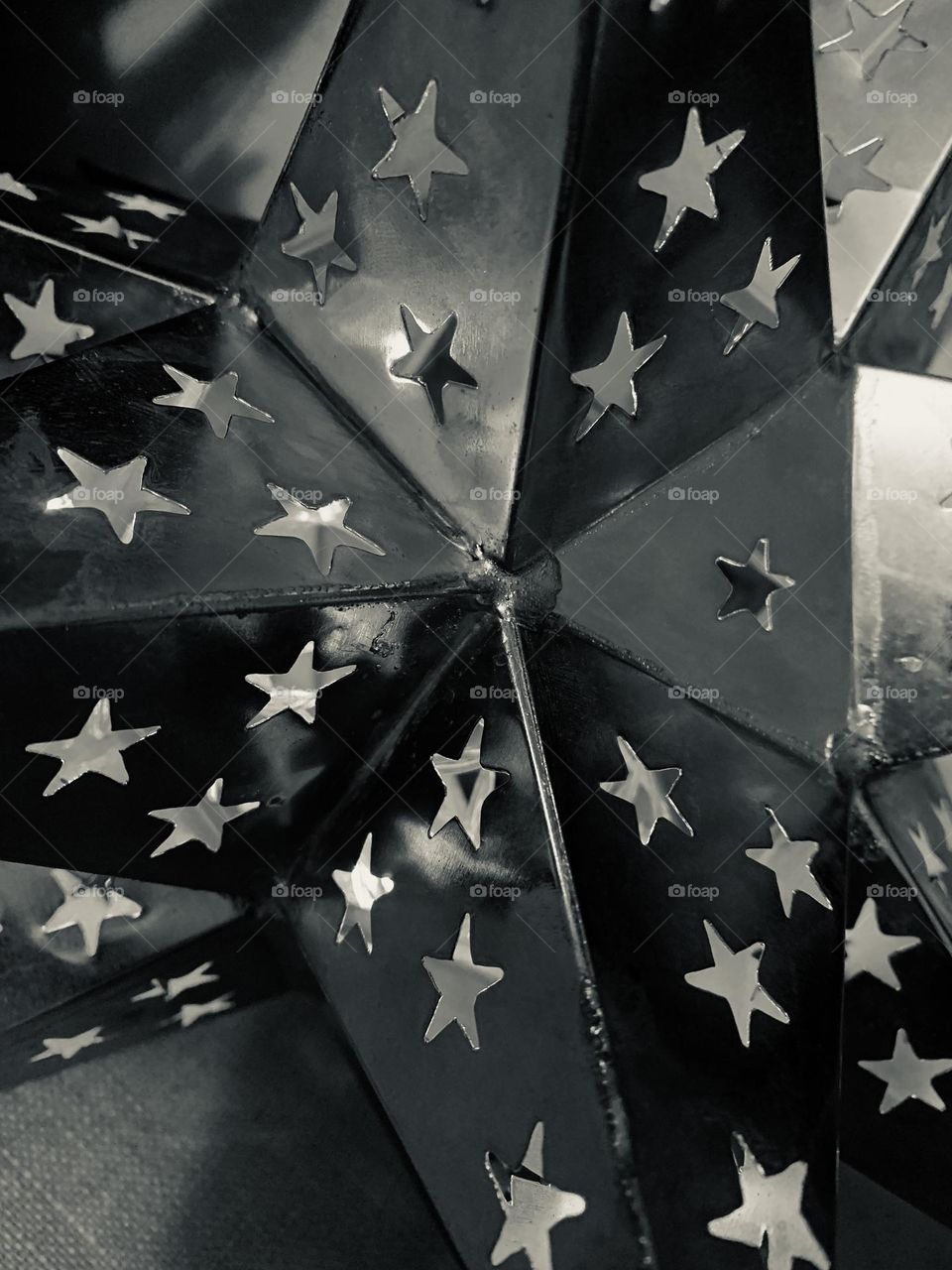 Black & white metal stars on star light