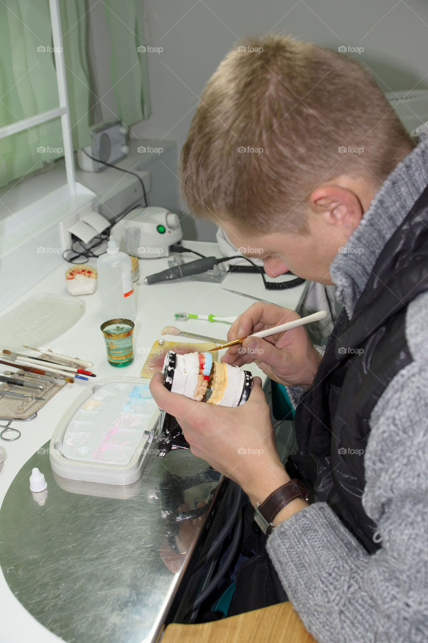 Dental technician on workplace