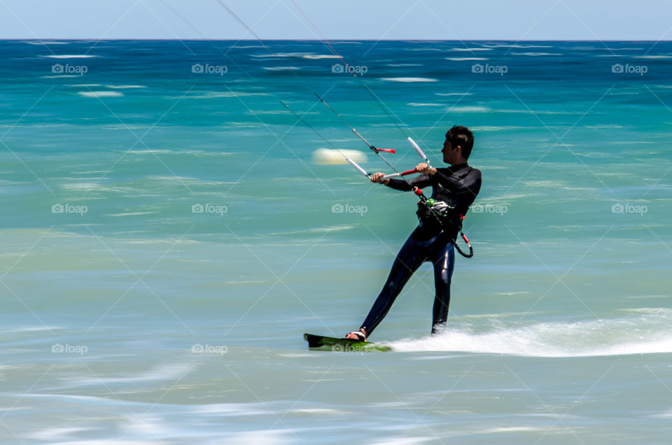 Kitesurfer, Marbella. Kitesurfer in Marbella, Spain panning photo