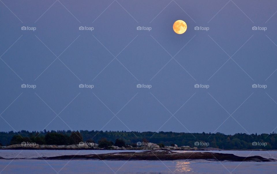 Reflection of moon at lake at ronneby archipelago sweden