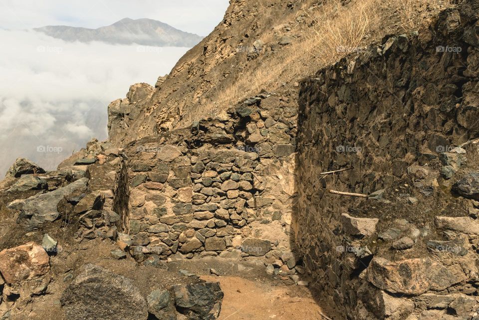 Archaeological remains of a stone house from the Spanish colonial period in Peru.