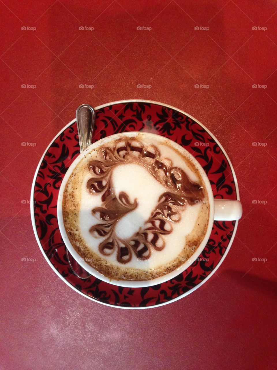 Cup of cappuccino with red background 