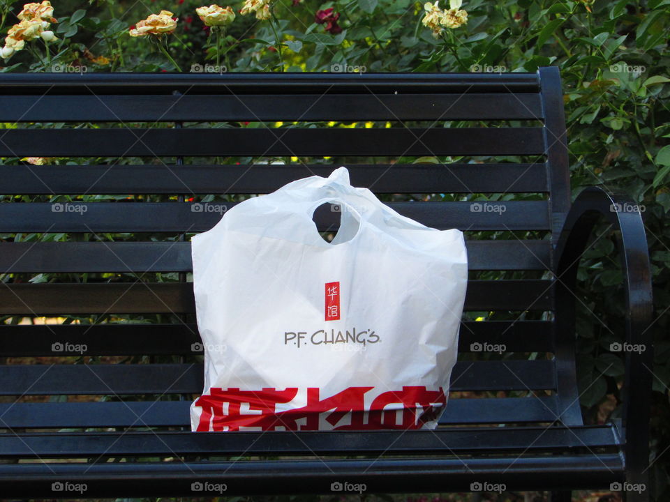 park bench with P.F. Chang's
