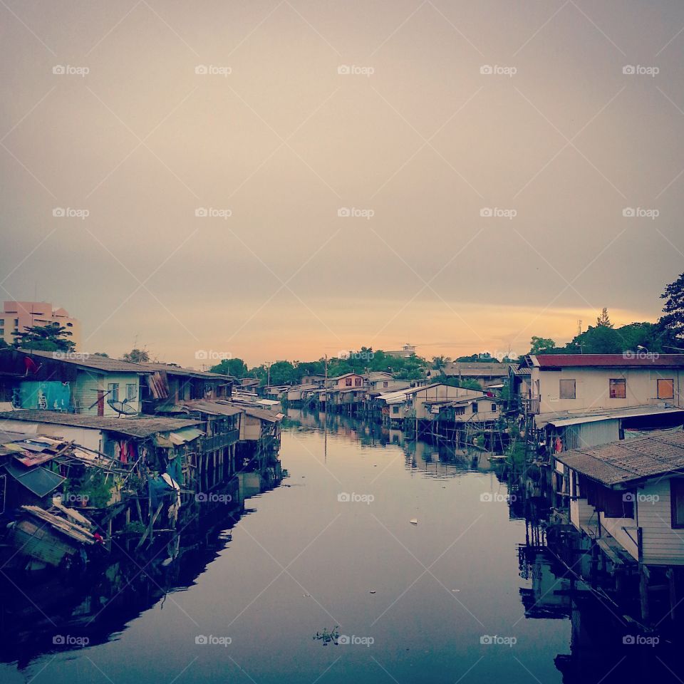 home beside the river in thailand. home beside the river in thailand at evening