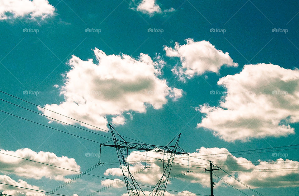 Vintage Sky Wire. Power lines in front of clouds