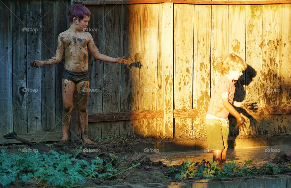 Kids Playing In Mud