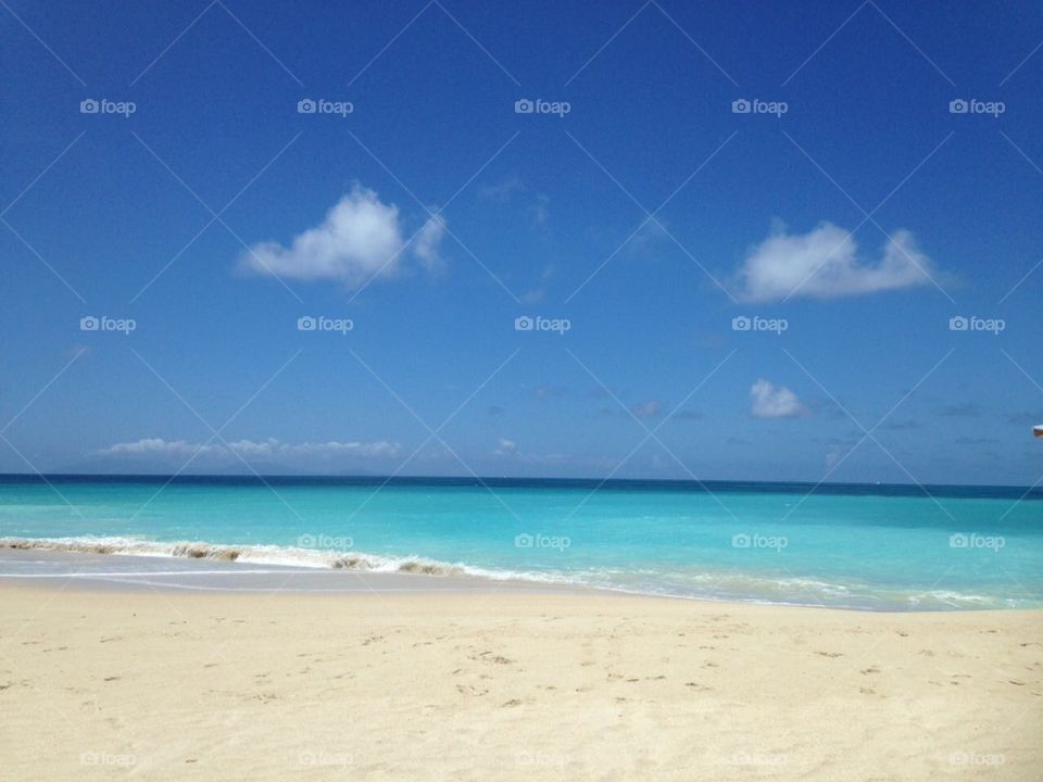 Summertime Everyday: Beautiful Caribbean beach. Warm, blue waters, cloudless sky, white sand. Serene, beautiful heaven. Vacation spot for you, home for me. Endless sky and endless sand. Endless love. Exotic paradise!