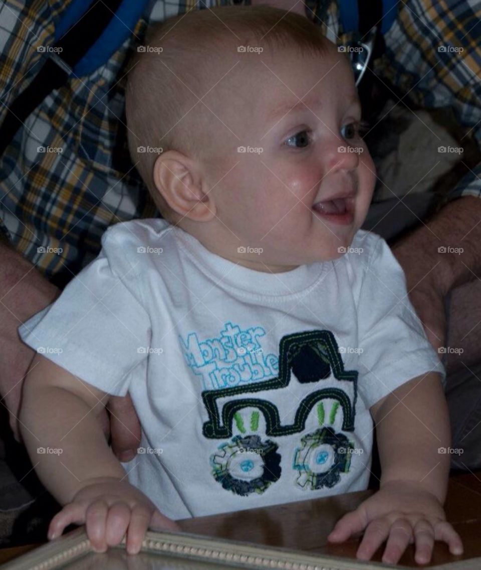 Smiling baby. A baby at a family get together with a happy smile.