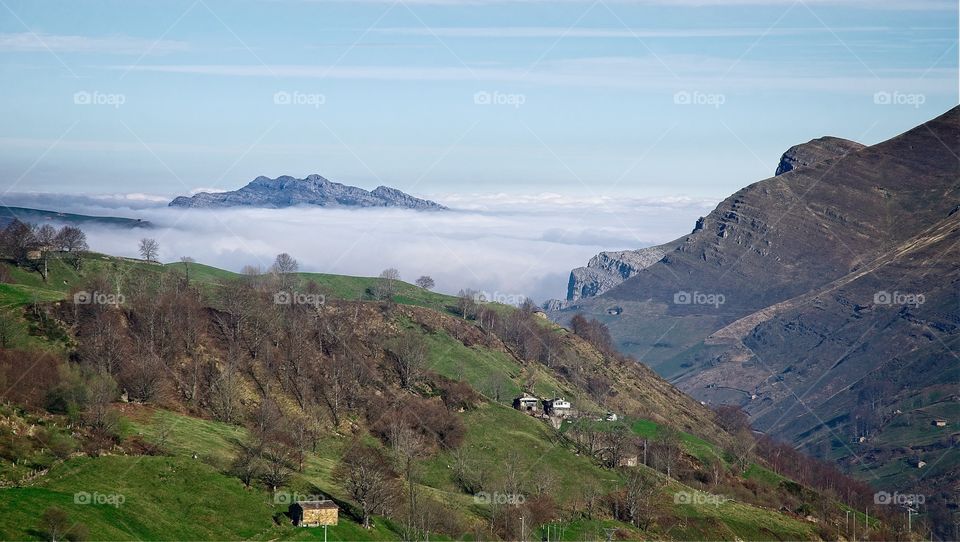 Clouds surrounding mountain