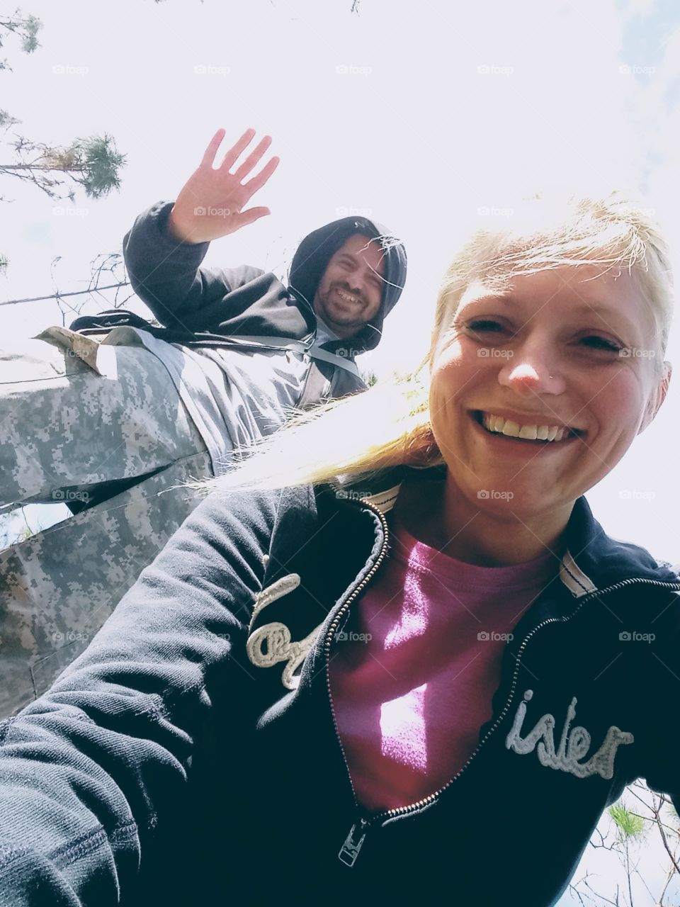 a happy man and woman outdoors together enjoying fresh air and nature.