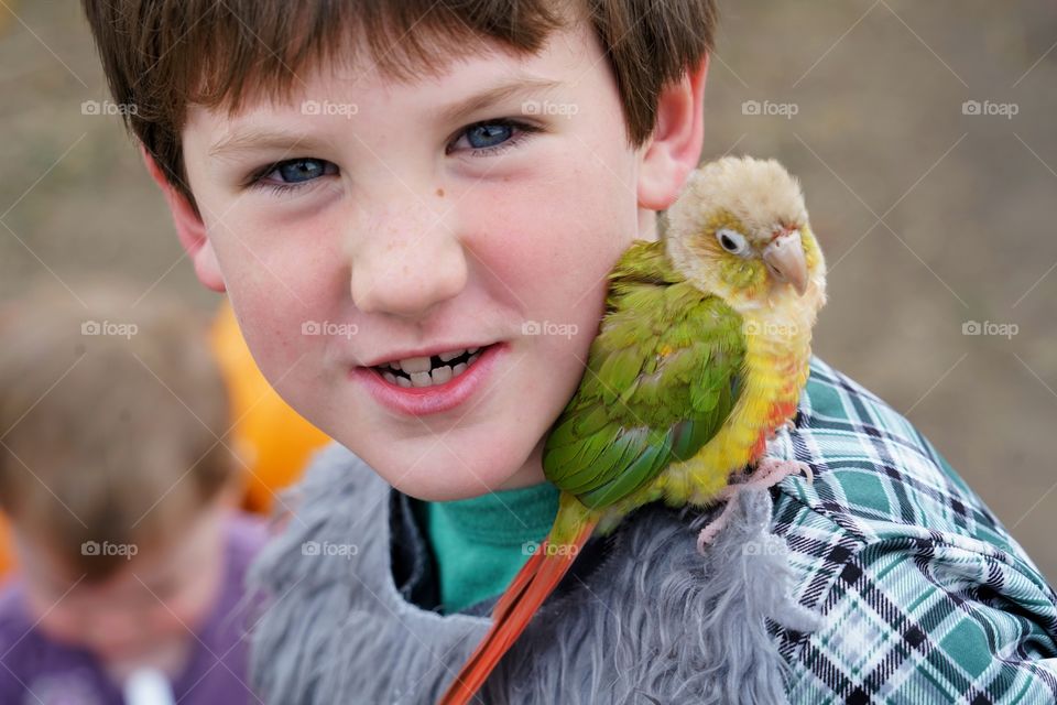 Boy With Pet Conure