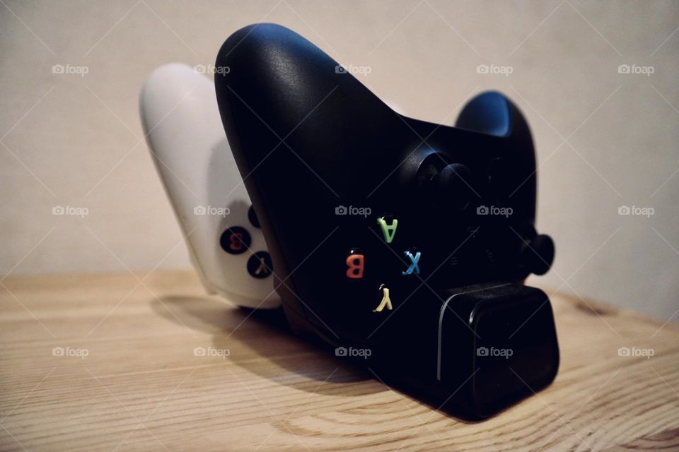 Xbox remote controllers in a charger 