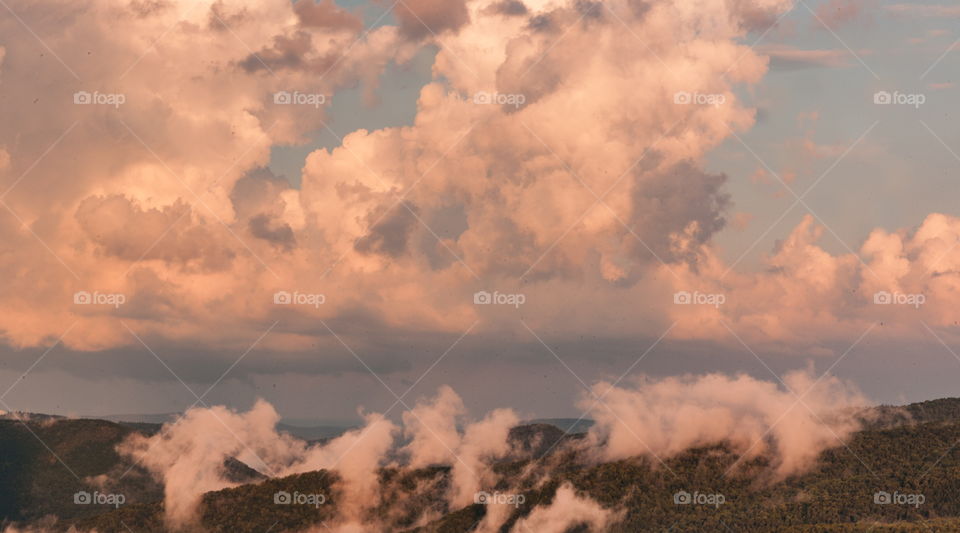 Colorful clouds over the mountains 
