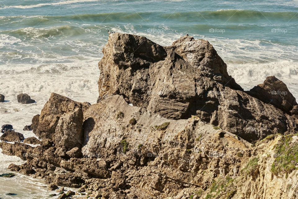 This rock between the beaches of Polvoeira and Paredes da Vitória on Portugal’s west coast is know as the Castelo/Leão (meaning Castle or Lion - depending on where you view it from I think)
