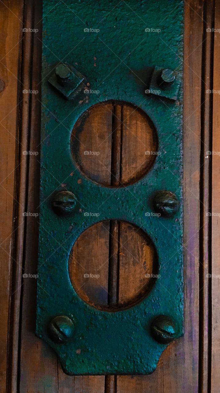Metal hardware on old barn  door 