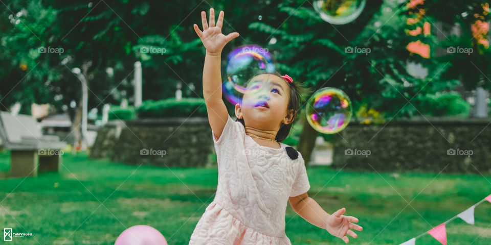 Playing at the park with bubbles