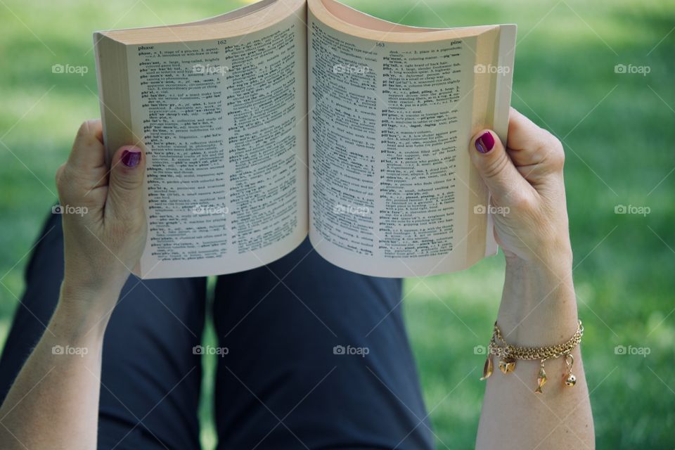 Reading a book outside 