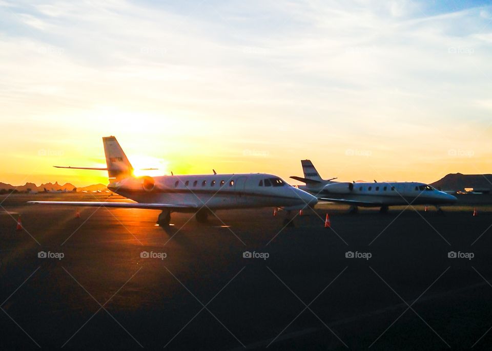 Business Jets at Sunset. Cessna Citation Sovereign and Cessna Citation XLS sit on the ramp in Tucson, AZ during sunset. 