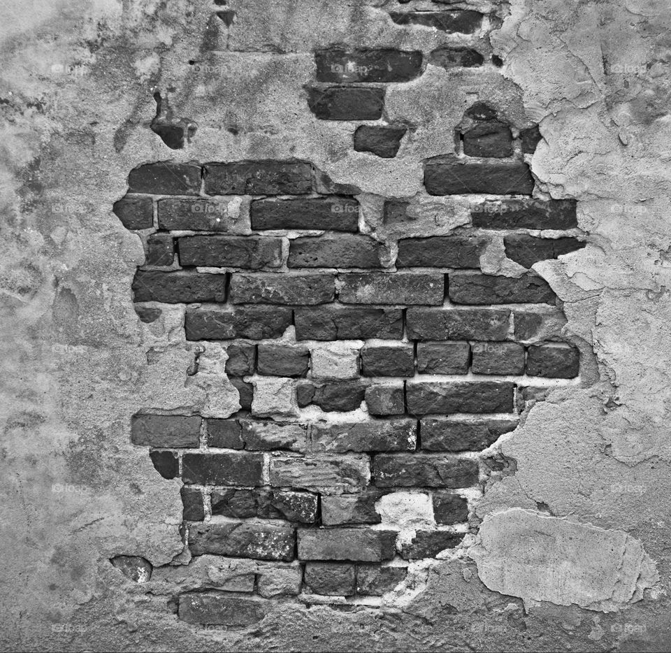 Black-and-white photography of an old historical brickwall building in the city of Sacramento California.