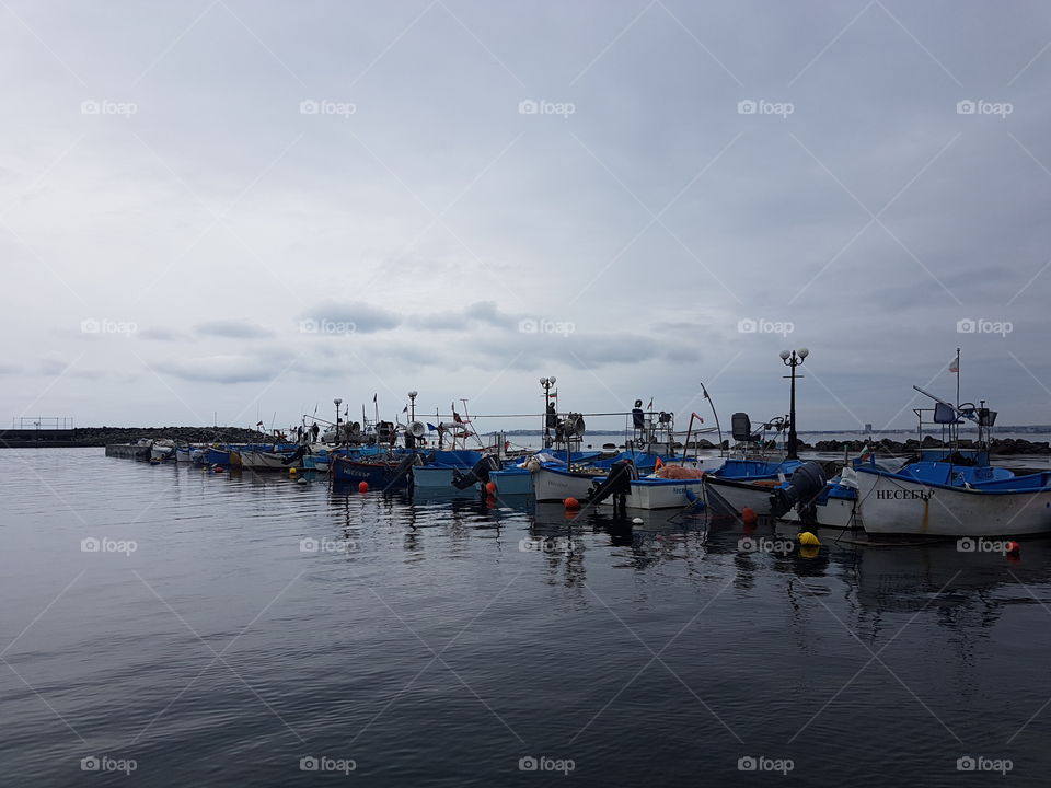 Boats on pier