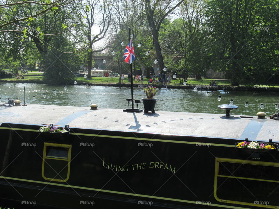 Canal boat moored on the river Thames windsor. With a inspirational name living the dream