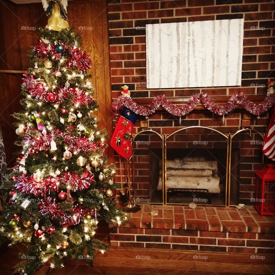 Christmas tree by the fireplace