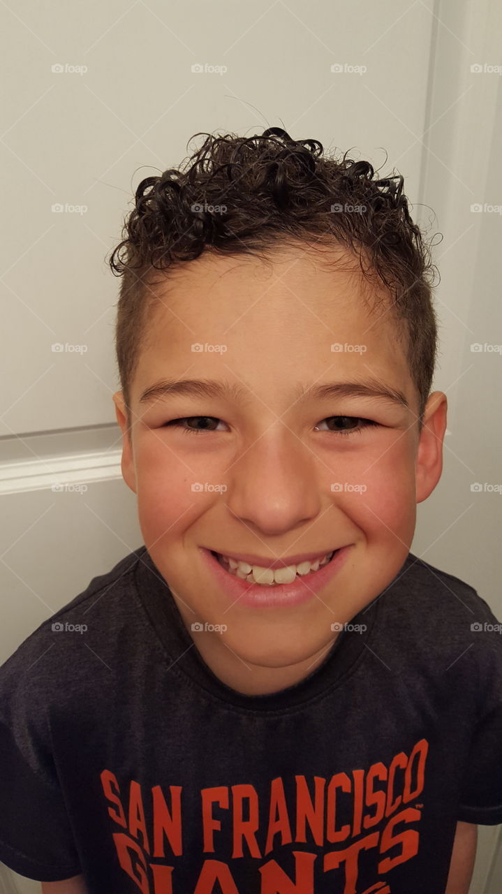 Portrait of boy with toothy smile