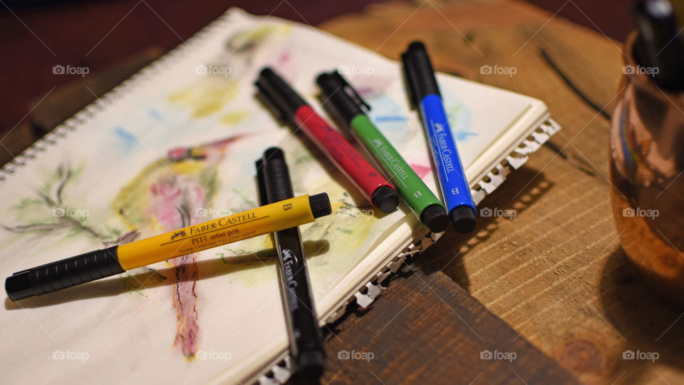Faber-Castell PITT artist pens on sketchbook with bird 