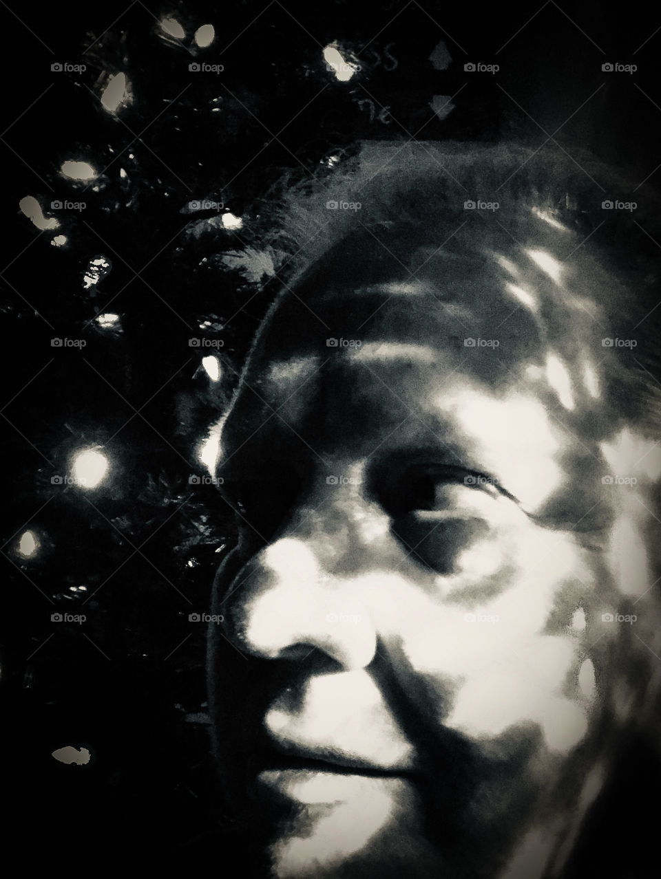 Experimenting with my kaleidoscope Christmas lights in monochrome. Fun, but super creepy!