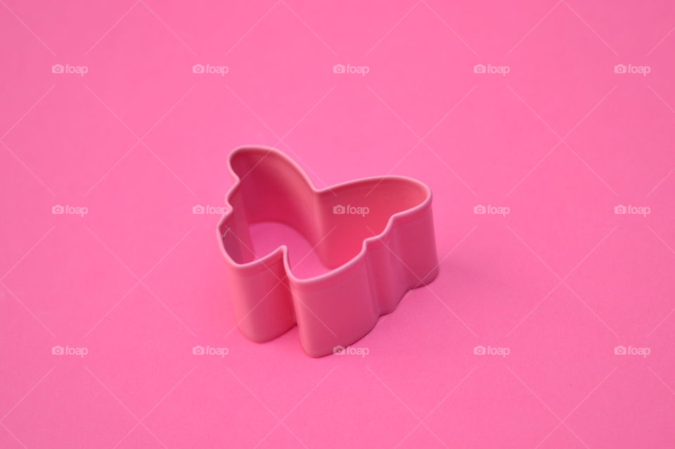 Cookiecutter shark against pink background