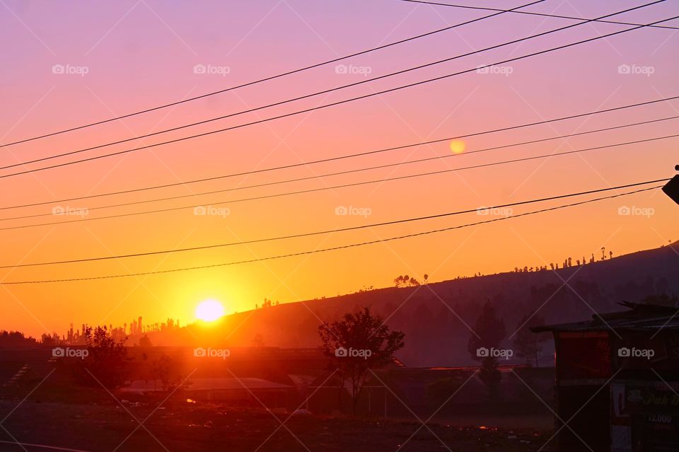 Panoramic view of colorful sunset in the mountains.