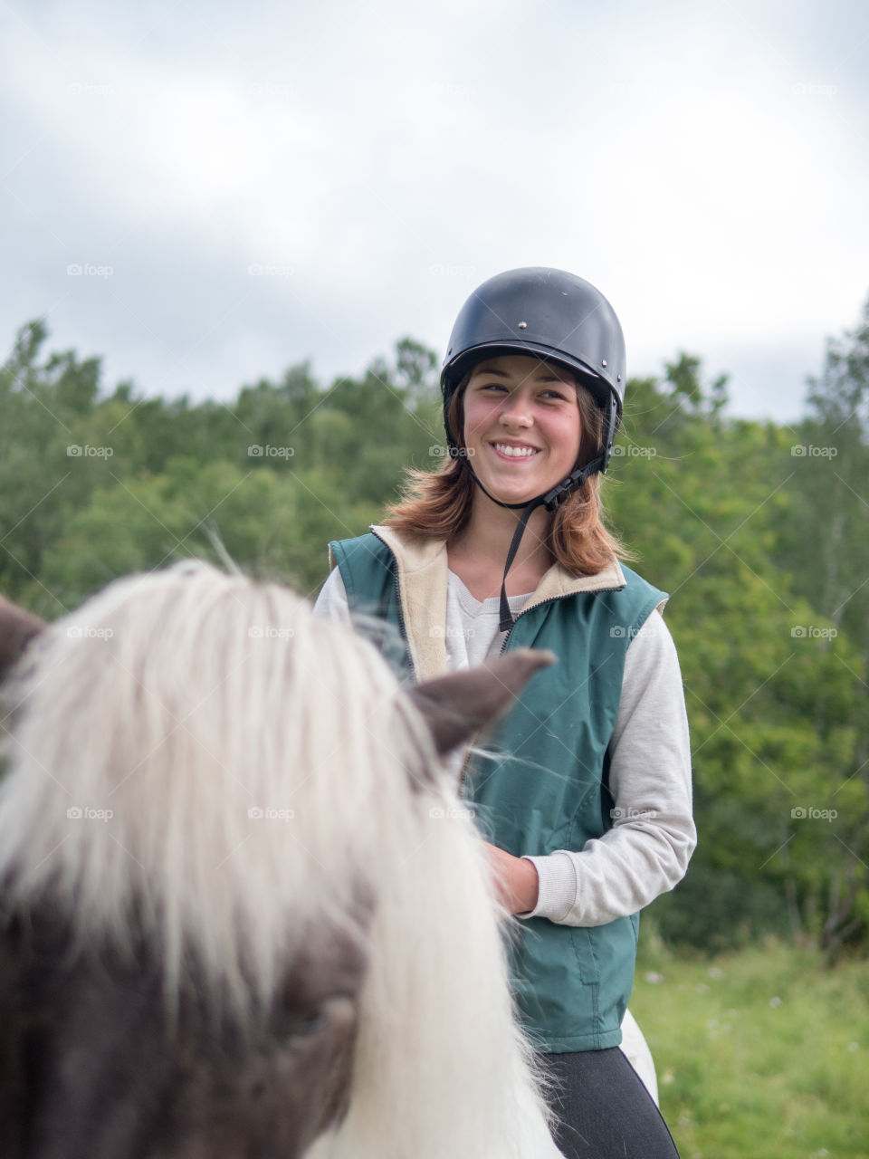 Portrait of woman riding on horse