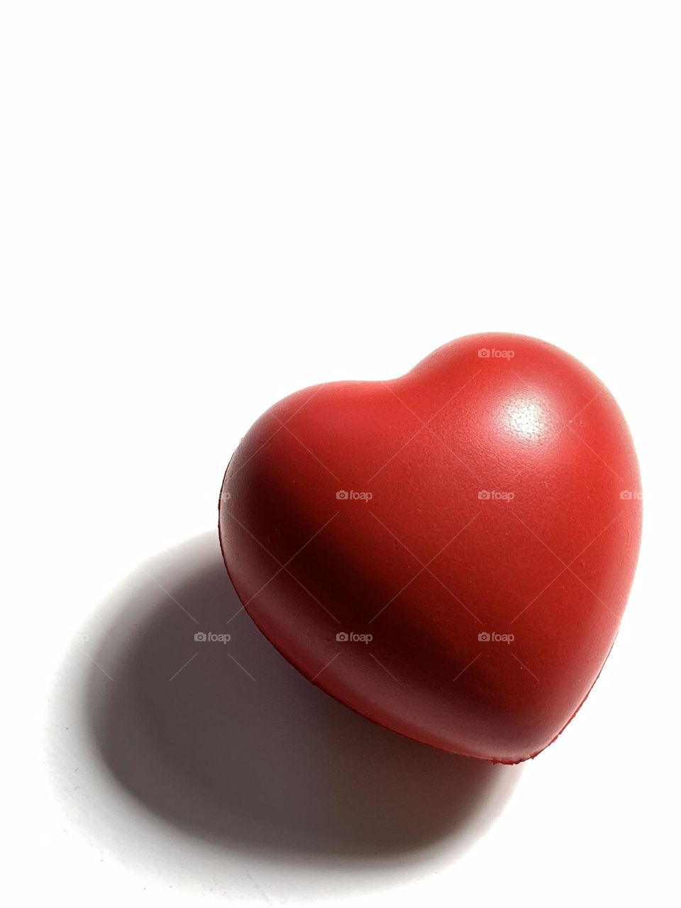 Red heart against white background.